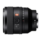 Sony G series camera lens in black with an orange G logo, showing the focus ring, aperture scale, AF-MF switch, and E-mount connector on a white background.