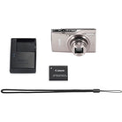 Canon digital camera with battery and charger on a white background