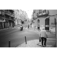 Snapic image of Black and white street scene with people on a city street