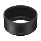 Black cylindrical Sony lens hood with a matte finish and white Sony logo, designed for the 100mm macro lens.