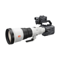 Sony FX6 cinema camera body with a large white G Master telephoto lens attached against a white background.
