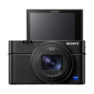 Black Sony RX100 VII compact camera with a ZEISS lens and a 180-degree upward-tilting touchscreen display.