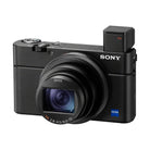 Black Sony RX100 VII compact camera with ZEISS lens and pop-up electronic viewfinder on a white background.