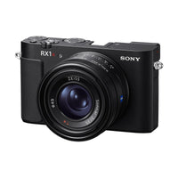 Compact black Sony RX1R III digital camera with a fixed ZEISS Sonnar 35mm f/2 lens and top-mounted control dials.