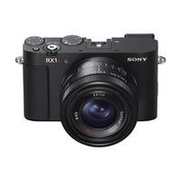 Compact black Sony RX1R III digital camera featuring a fixed ZEISS 35mm f/2 lens and top-mounted manual control dials.