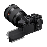 Sony a7R VI mirrorless camera with a black body, attached lens, and a multi-angle tilting touchscreen LCD display.