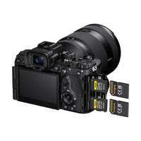 Sony a7R VI mirrorless camera with articulating LCD screen, lens attached, and dual CFexpress memory card slots open.