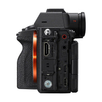 Side view of black Sony a7R VI mirrorless camera body showing open port covers, HDMI, USB-C, and audio input jacks.