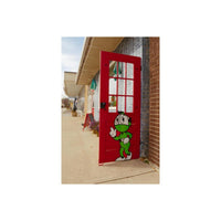 Red door with a cartoon character on it in front of a building