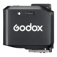 Black Godox device with USB port and logo on a white background