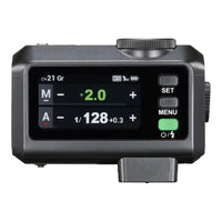 Black electronic device with digital display and control buttons on a white background