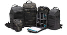 Set of tactical backpacks with various compartments on a white background