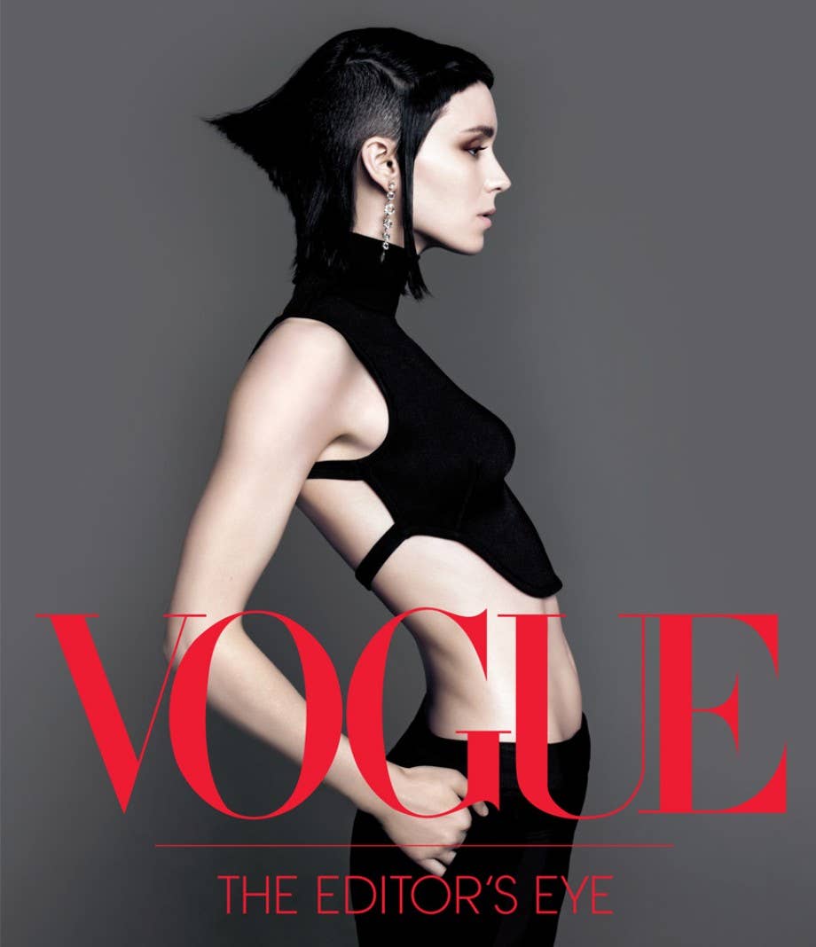 Vogue magazine cover with a woman in a black outfit on a gray background