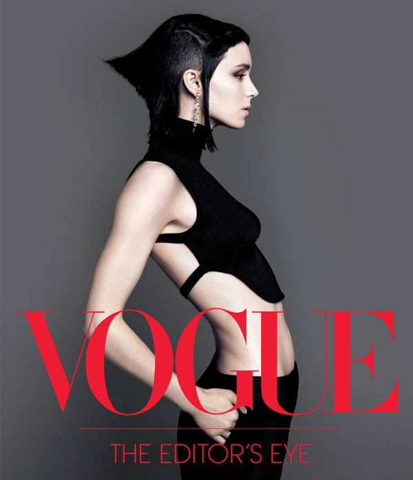 Vogue magazine cover with a woman in a black outfit on a gray background