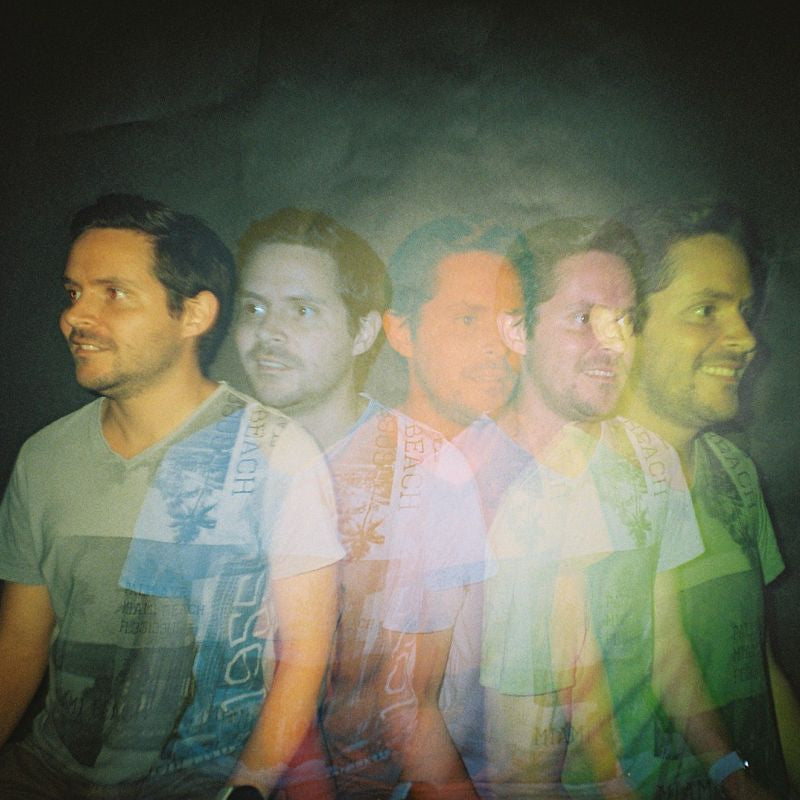 Multiple images of a man with a dark background