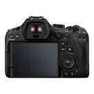 Back view of a black camera with control buttons on a white background