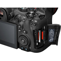 Close-up of a camera body with control buttons and card slot on a white background