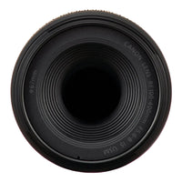 Close-up of a Canon camera lens on a white background