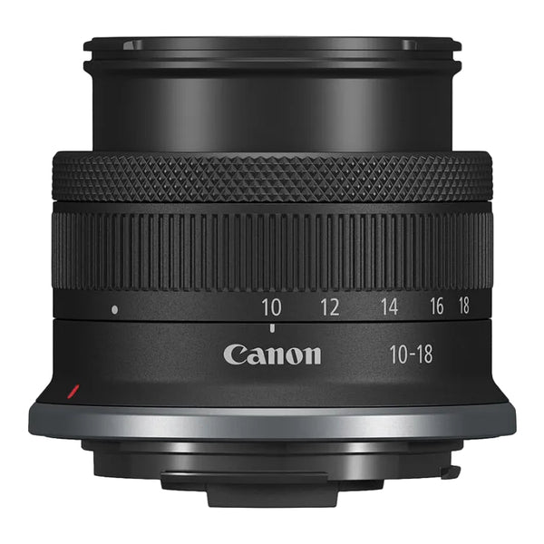 Canon camera lens with focus scale and brand logo on a white background