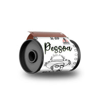 A 36 EXR film roll on a spool with a custom white label featuring the name 'Pessoa' and a black-and-white illustration of a man in a hat, shown on a white background.