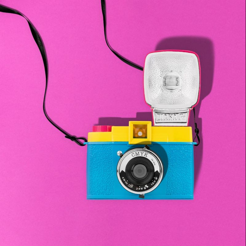 Colorful camera with a pink background