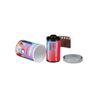 A roll of double film Steril 400 shown with its colorful cylindrical canister, a brown film strip, and a gray lid on a plain white background.