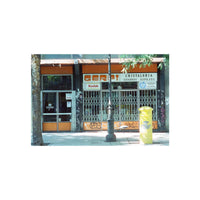 A street scene photograph of a storefront with orange and white signage reading 'Cristalería Cajas Ríos' and a visible Kodak logo, with metal security gates, sidewalk, tree trunk, lamp post, and a yellow trash can.