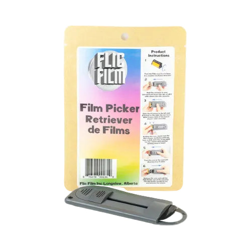 A FliC Film film picker retriever tool shown in front of its retail packaging card. The product is a dark gray plastic tool with a metal ring, and the packaging features a colorful gradient label with product instructions.