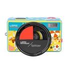 A retro-style Lomo Apparat Splitzer instant camera with a colorful yellow and blue patterned body, featuring a prominent black lens cover in the foreground.