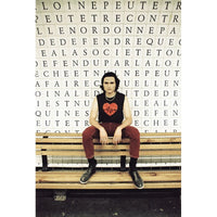 Person sitting on a bench with a text-based design in the background