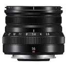 Black camera lens with focus ring and number indicators on a white background