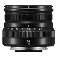 Black camera lens with focus ring and number indicators on a white background