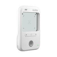 A white Godox wireless remote control with a digital display screen, three control buttons, and a central power button, shown on a solid white background.