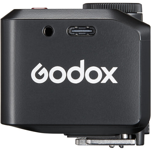 Black Godox device with USB port and logo on a white background
