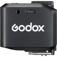 Black Godox device with USB port and logo on a white background