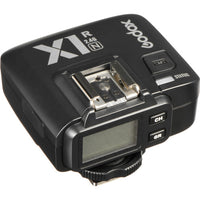 Godox camera flash transmitter on a white background