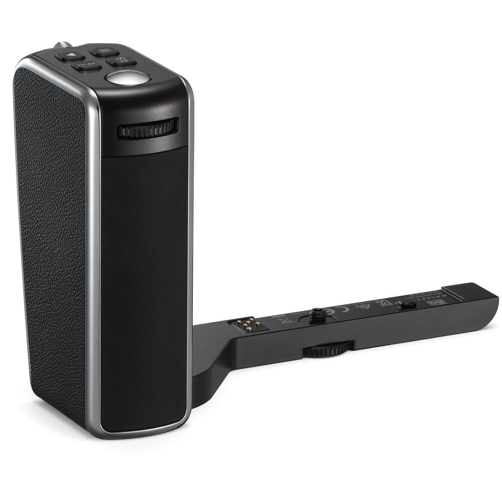 Black electronic device with a detachable component on a white background