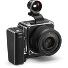 Camera with lens and additional attachment on a white background