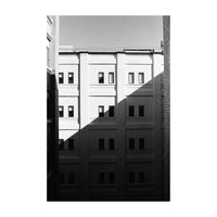 Black and white architectural photograph of a building with shadows