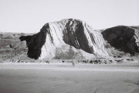 Black and white photograph of a landscape of desert mountains shot using lomography lady grey film