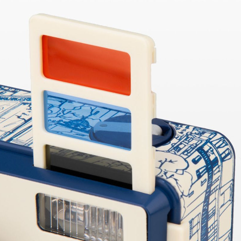 Toy camera with a red and blue filter on a white background