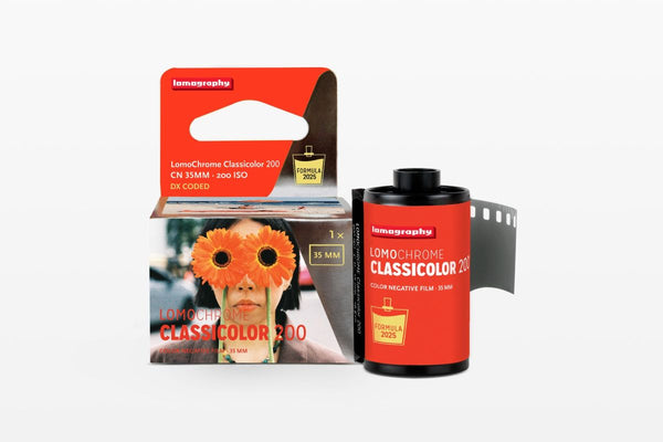 Lomography film roll and packaging on a white background