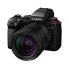 Black Panasonic Lumix camera on a white background