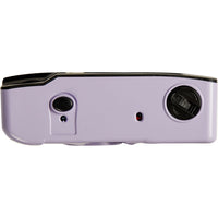 A light purple projector shown from the back, featuring a black top edge, a rear projection lens, a rear slide throw button, and a small red indicator light, set against a plain white background.
