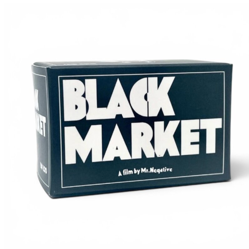 A rectangular product box for the film 'Black Market' by Mr. Negative, featuring bold white title text on a dark navy background with a thin white border, shown on a clean white studio background.