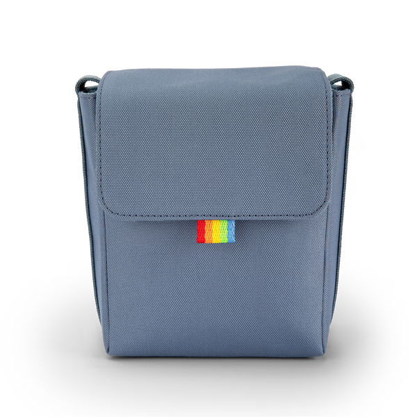 Blue rectangular bag with a colorful tag on a white background