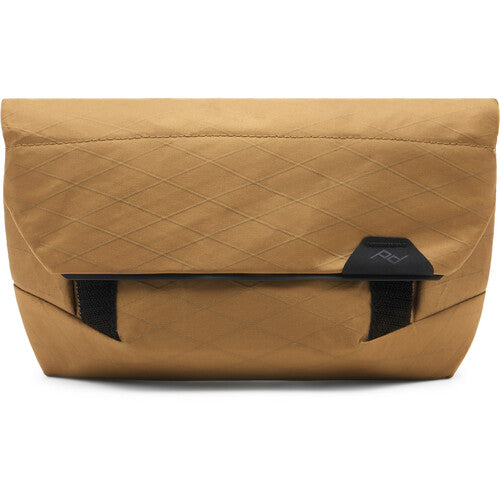Tan nylon bag or sling bag with black accents on a white background
