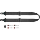 Black camera strap with quick-release clasp and additional attachments on a white background