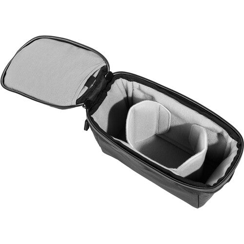 Black travel case with open lid on a white background