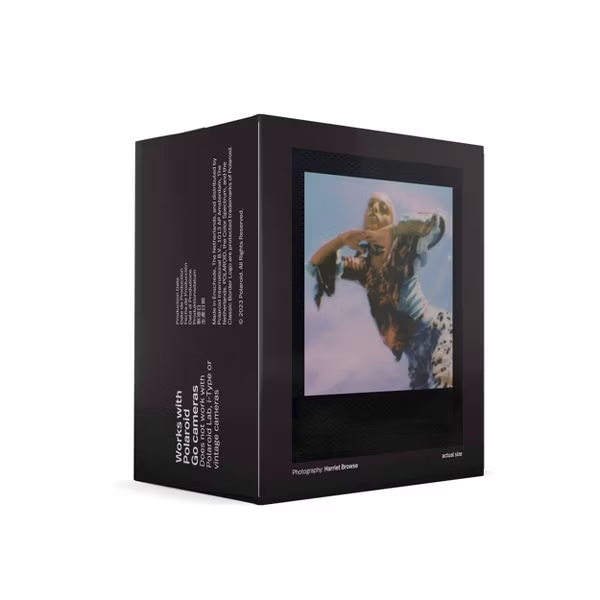 Black box with polaroid image of a woman with colorful pastel clothing and white text 